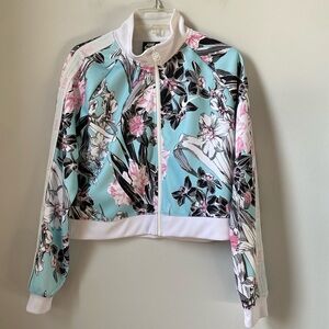 Nike women’s floral zip front jacket with pockets. Size medium. Pink aqua white
